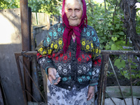 Patskan Zianida Vasilivna, an old woman aged of 70 in her house freshly destroy by an heavy shoot of artillery during the night (