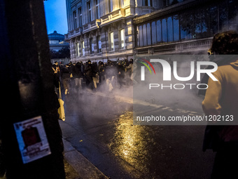 Protesters clash with anti-riot police during a demonstration against the use of the French constitution's Article 49,3, allowing the govern...
