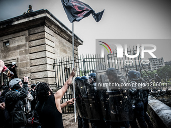 Protesters try to penetrate the Army Museum in Paris.The soldiers and police arrived as reinforcements to block the entrance during a protes...