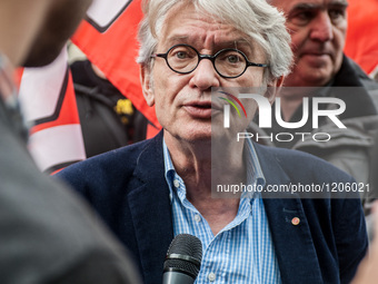 The Secretary General of FO labor union, Jean Claude Mailly, leads the procession under the protection of the order of unions service during...