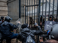Protesters try to penetrate the Army Museum in Paris.The soldiers and police arrived as reinforcements to block the entrance during a protes...