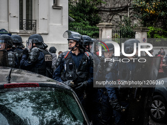 A police point of flashball LBD to the protesters and photographers during a protest after the French government made use of the constitutio...