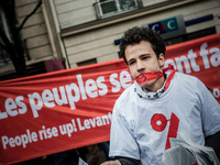An activist of ATTAC was gagged with a 49-3 banner during a protest after the French government made use of the constitution's Article 49-3...