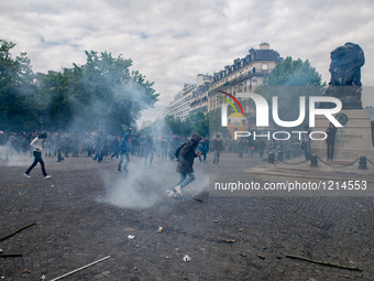 Clashes between demonstrators and riot police during a demonstrators during a rally against the government's planned labour law reforms, in...