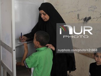 An Egyptian voter in a polling station in the Menia City, south of Cairo on the first days of elections on May 26, 2014 in Cairo, Egypt. Egy...