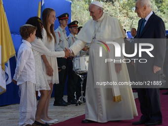 Pope Francis is welcomed by Israeli President Shimon Peres ahead of a meeting at the presidential residence in Jerusalem on May 26, 2014. Ma...