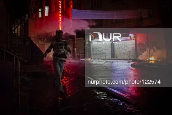 A protester during clashes with police in the Alevi enclave of Okmeydani on Istanbul on May 26, 2014. 