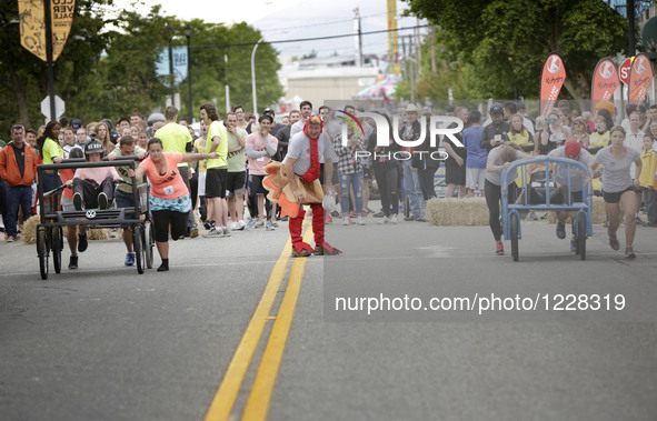 People participate the 39th Cloverdale Bed Race in Surrey, Canada, May 19, 2016.