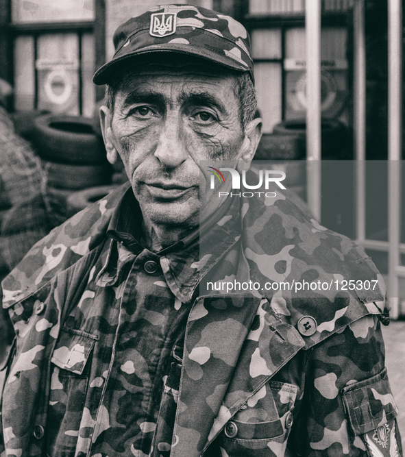 Ukraine - Kyiv - 07 May 2014 - Soldier of the new people's army guarding check point on Maidan place in Kiev. 