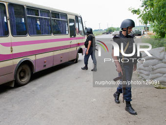 Police special opps check a bus on the road to Donetsk (