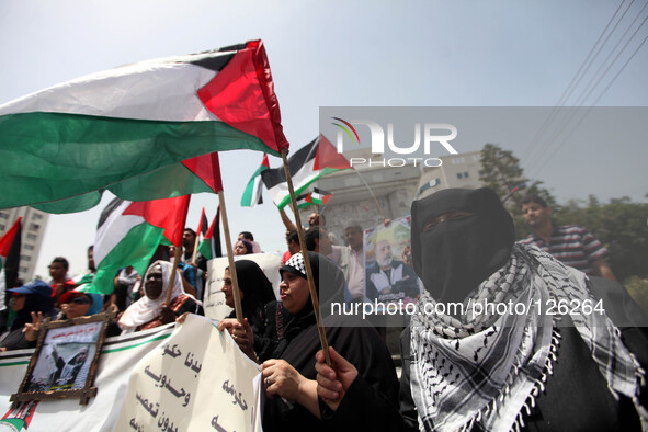 Palestinian protesters chant slogans to speed up the implementation of the national reconciliation and the announcement of the formation of...