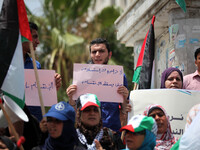 Palestinian protesters chant slogans to speed up the implementation of the national reconciliation and the announcement of the formation of...