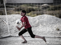 Bahraini boys play football in Bahrain, on May 31, 2014. (
