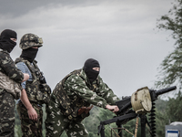 National Guard soldiers shoot the grenade launcher during the fight with pro-russian separatist near Slaviansk, on May 31, 2014. Over 20 Ukr...