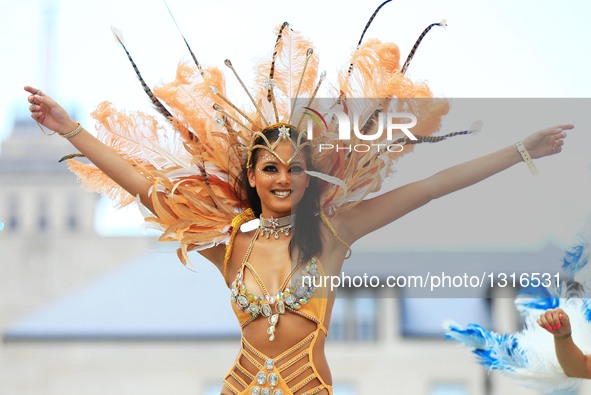 A dressed up reveller performs during the official launch ceremony of the 2016 Toronto Caribbean Carnival at Nathan Philips Square in Toront...
