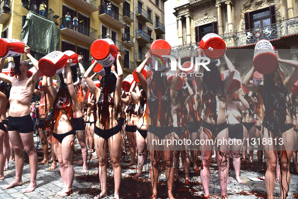 Activists From Around the World Descend on Pamplona's Main Square to Demand an End to Cruel Running of the Bulls on July 5, 2016. Wearing li...