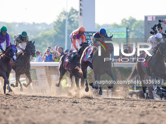 Racehorse Tonalist, ridden by jockey Joel Rosario, wins the 146th running of the Belmont Stakes, at Belmont Park in Elmont, NY, June 7, 2014...