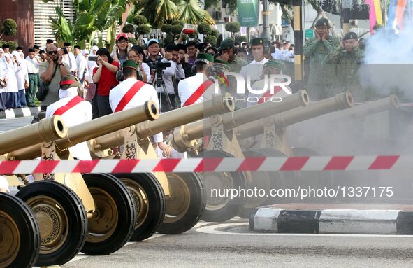 Salutes are fired during a ceremony to celebrate the 70th birthday of Brunei's Sultan Haji Hassanal Bolkiah in Bandar Seri Begawan, Brunei,...