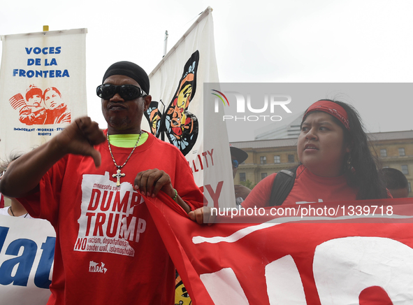 People protest against Donald Trump on the first day of the Republican National Convention in Cleveland, Ohio, the United States, July 18, 2...