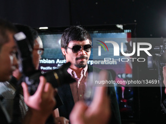 Makati, Philippines - Filipino boxing champion Manny Pacquiao arrives at a press conference in Makati, east of Manila on June 9, 2014. Manny...
