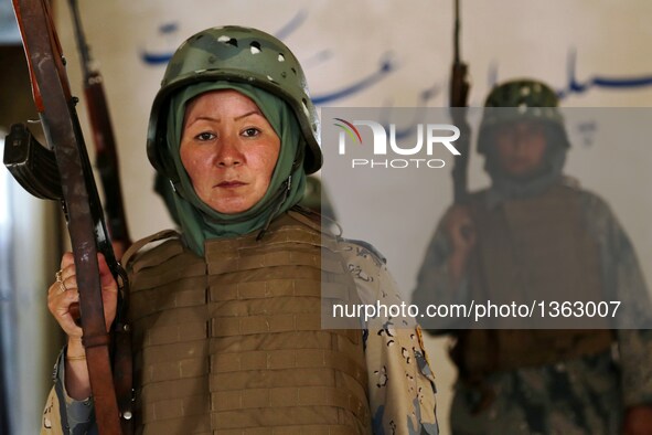 An Afghan border policewoman takes part in a military training at a training center in Herat province, Afghanistan, July 30, 2016. Afghan go...