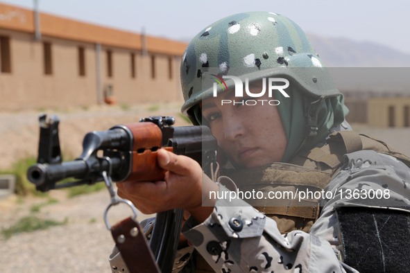 An Afghan border policewoman takes part in a military training at a training center in Herat province, Afghanistan, July 30, 2016. Afghan go...