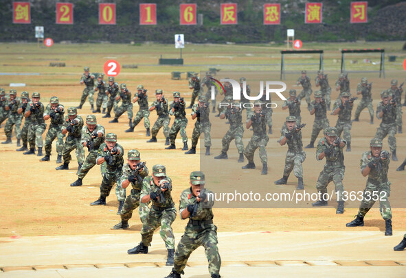 Soldiers attend an anti-terrorism drill in Fusui County of Chongzuo City, south China's Guangxi Zhuang Autonomous Region, July 30, 2016. Mor...