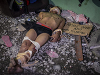 (EDITORS NOTE: Image depicts graphic content.) The corpse of a suspected house thief and victim of a vigilante-style execution with his limb...