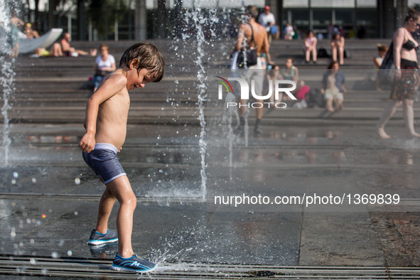 A boy cool down while playing in a fountain in Moscow, Russia, on Aug. 2, 2016.