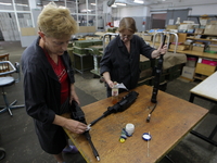 Ukrainian female workers check parts of weapons at the 'Mayak' plant in Kiev. Ukraine, 4 August, 2016. 'Mayak' is one of the plants which pr...