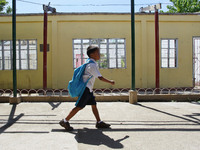 Tacloban, Philippines - A student walks past a damaged school building in San Jose Central School, Tacloban City on June 11, 2014. On Novemb...