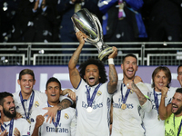 Marcelo lifts the trophy after the UEFA Super Cup match between Real Madrid and Sevilla at Lerkendal Stadion on August 9, 2016 in Trondheim,...