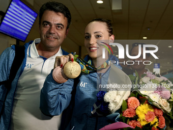 Greek gold medalist at the Rio 2016 Olympics, Anna Korakaki, with her father and personal coach,Tasos Korakakis, pose to press photographers...