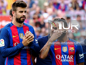 Gerard Pique and Douglas during the presentation of the Barcelona team 2016-17, held in the Camp Nou stadium, on august 10, 2016. (