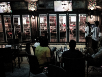 Bahrain , Muharraq - fans watching the match and smoking Shisha , atmosphere of the first match of World Cup 2014 which hold in Brazil on Ju...