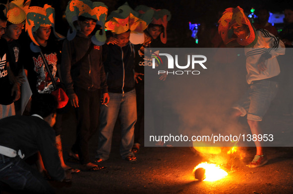 SOLO, CENTRAL JAVA, INDONESIA - JUNE 12 : Indonesian men playing football fire 
