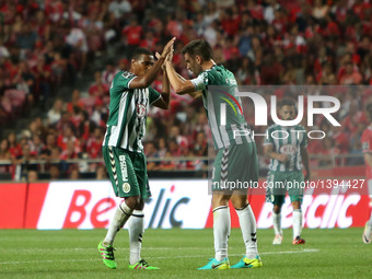 Setubal's defender Frederico Venancio (R ) celebrates with Setubal's defender Vasco Fernandes after scoring during the Portuguese League foo...
