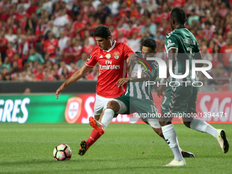 Benfica's forward Goncalo Guedes  vies with Setubal's forward Andre Claro during the Portuguese League football match SL Benfica vs Vitoria...