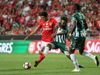 Benfica's forward Goncalo Guedes  vies with Setubal's forward Andre Claro during the Portuguese League football match SL Benfica vs Vitoria...