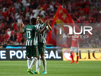 Setubal's defenders Frederico Venancio (C ) and Vasco Fernandes (L ) celebrate after the Portuguese League football match SL Benfica vs Vito...