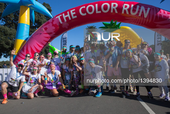People pose for photos before starting running during the Color Run in Sydney, Australia, on Aug. 21, 2016. The Color Run, known as 