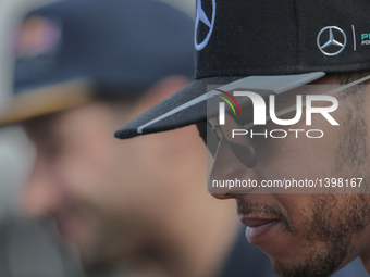 Lewis Hamilton of Great Brittain and AMG Petronas Mercedes driver and Daniel Ricciardo of Australia and RedBull racing team driver at the in...