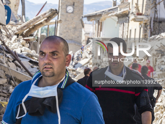 Rescuers search for victims in damaged buildings after a strong earthquake hit Amatrice on August 24, 2016. Central Italy was struck by a po...