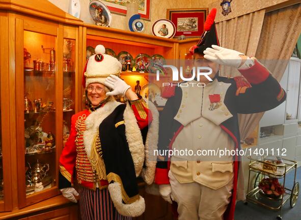 Jasques Fieuw and his wife Pauline salute as they are dressed in Napoleonic French military uniforms at their home in Brussels, Belgium, Aug...