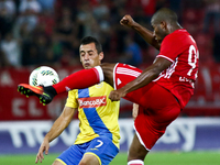Olympiaco's Brazilian forward Seba (R) in action with Arouca's Portuguese midfielder Artur Moreira (L) during UEFA Europa League match betwe...