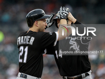 Chicago White Sox third baseman Todd Frazier (21) is congratulated by designated hitter Justin Morneau (44) after his two-run home run in th...