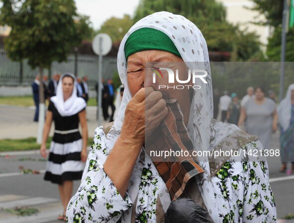 A woman cries for the death of the late president of Uzbekistan Islam Karimov in Samarkand, Uzbekistan, on Sept. 3, 2016. The funeral of the...