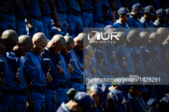 Cadets stand in silence during the commemoration for 40 deceased police officers in Pretoria, South Africa, Sept. 4, 2016. The South African...