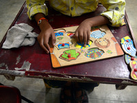 Adarsh , an 8 years old special child , suffering from cerebral palsy , studies as he learns recognizing things by touching  in a'Umang' sch...