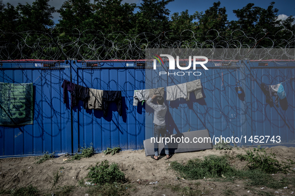 A refugee man at a makeshift refugee camp on the Serbian side of the border with Hungary near the town of Horgos on August 12, 2016. 